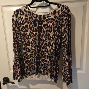 I.N.C. animal print top with embellishments on slightly flared sleeves. SZ M